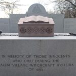 Witch Trials Memorial, Salem MA. A stone pedestal engraved with the message, "In memory of those innocents who died during the Salem Village witchcraft hysteria of 1692."