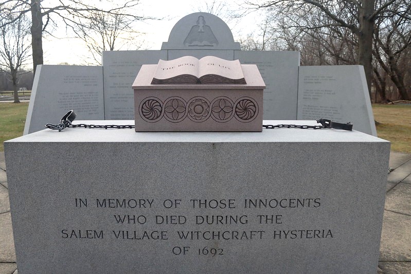 Witch Trials Memorial, Salem MA. A stone pedestal engraved with the message, "In memory of those innocents who died during the Salem Village witchcraft hysteria of 1692."